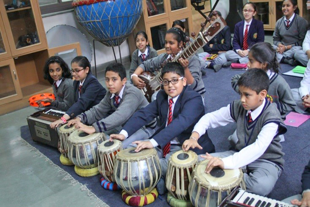 Students playing table,sitar, harmonium etc