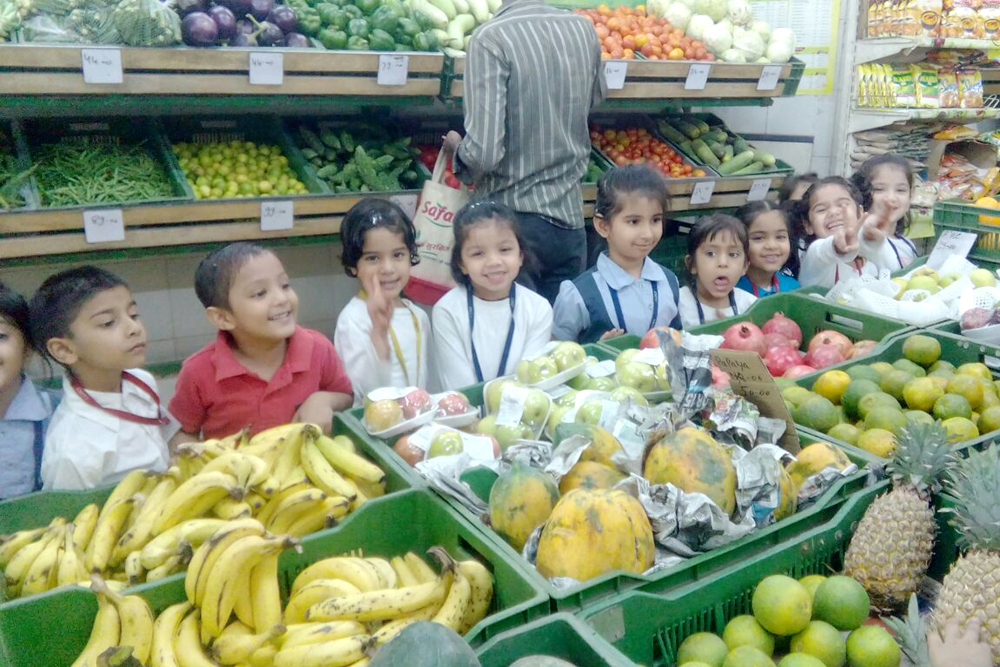 Primary students learning to buy vegetables in SAFAL store